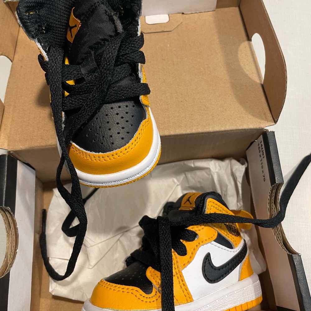 Yellow black and white Jordan mid
